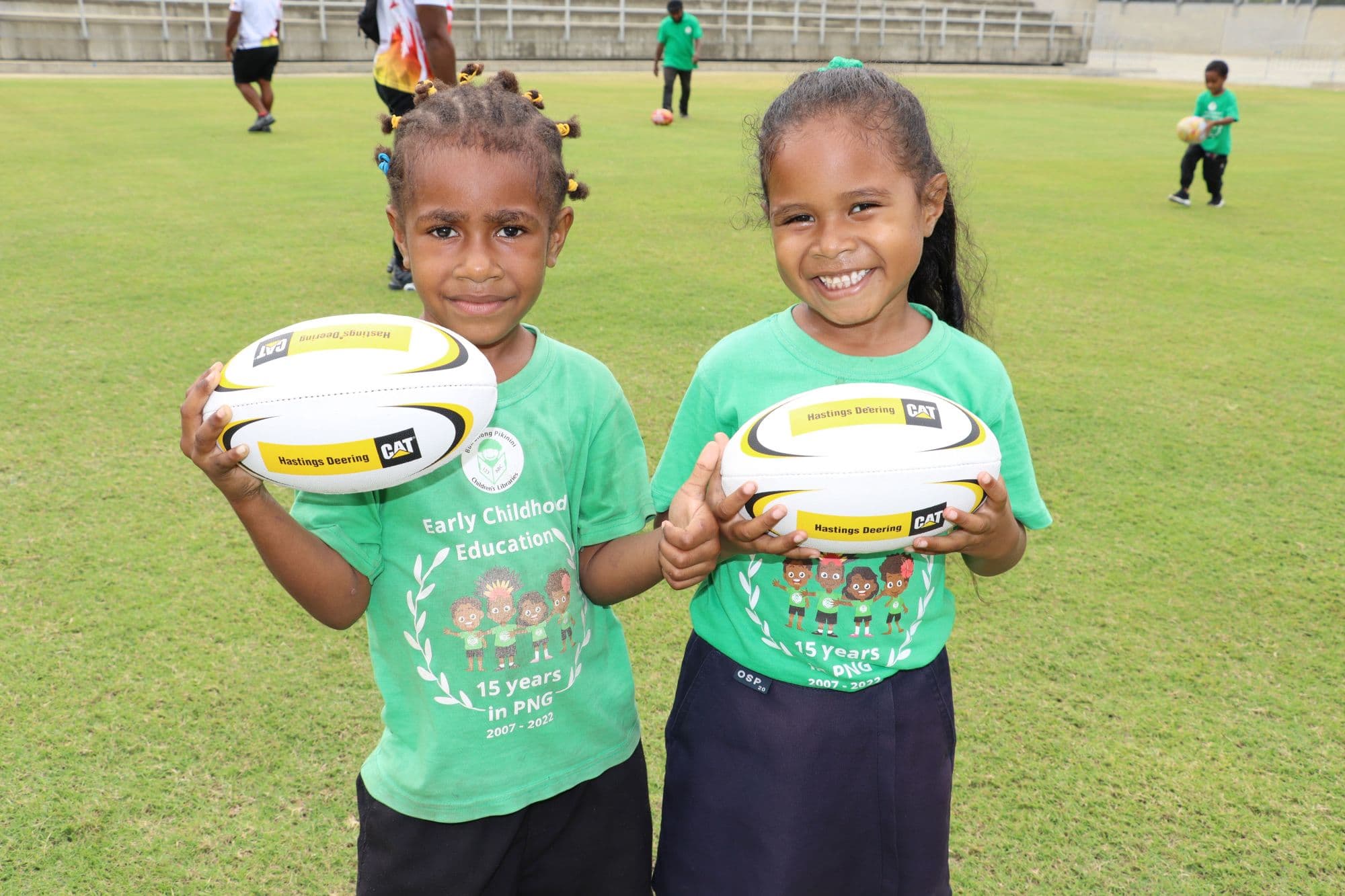 Hastings Deering - Hunters Activation day two young girls holding rugby balls