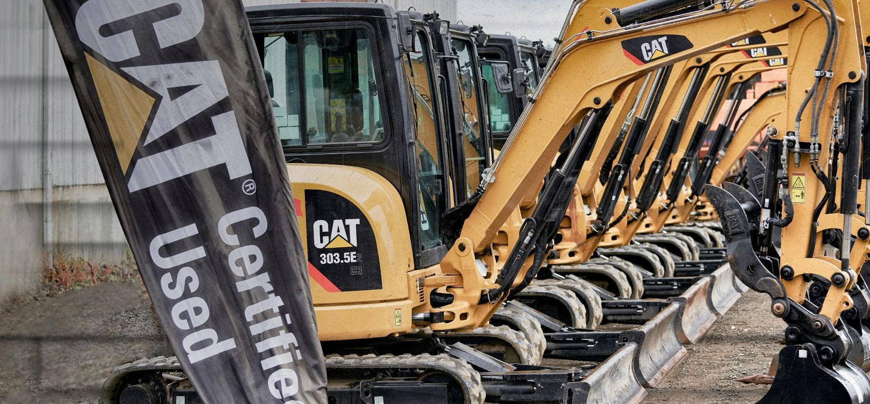 Cat Certified Used Machinery - Row of Excavators